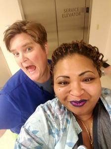 RN, Karyn E., posing for a selfie with her coworker.