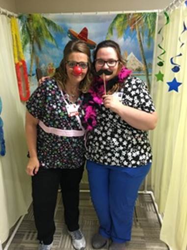 RN, Trisha P., posing  for a goofy photo with a friend during Nurses Week.
