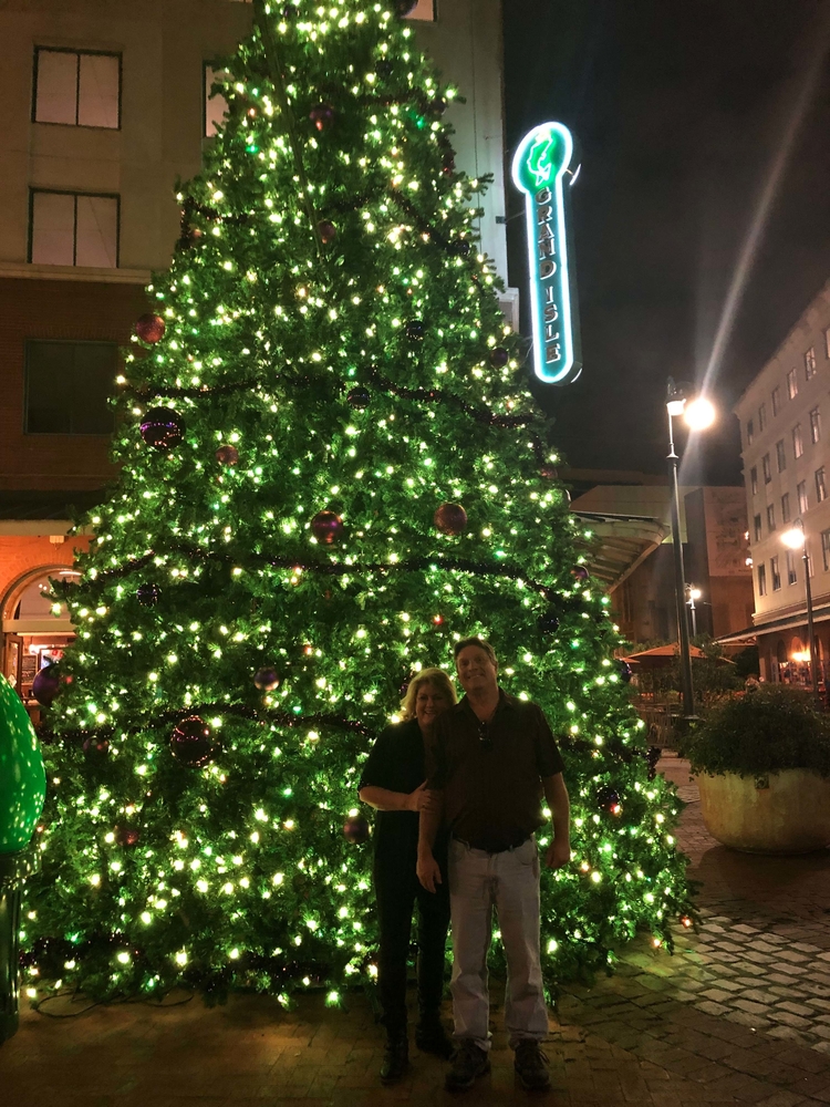 RN, Jan K., with her husband Kerry in front of a Christmas display in New Orleans, Louis.